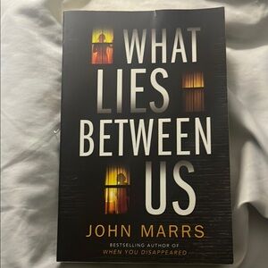 'What Lies Between Us' Book
